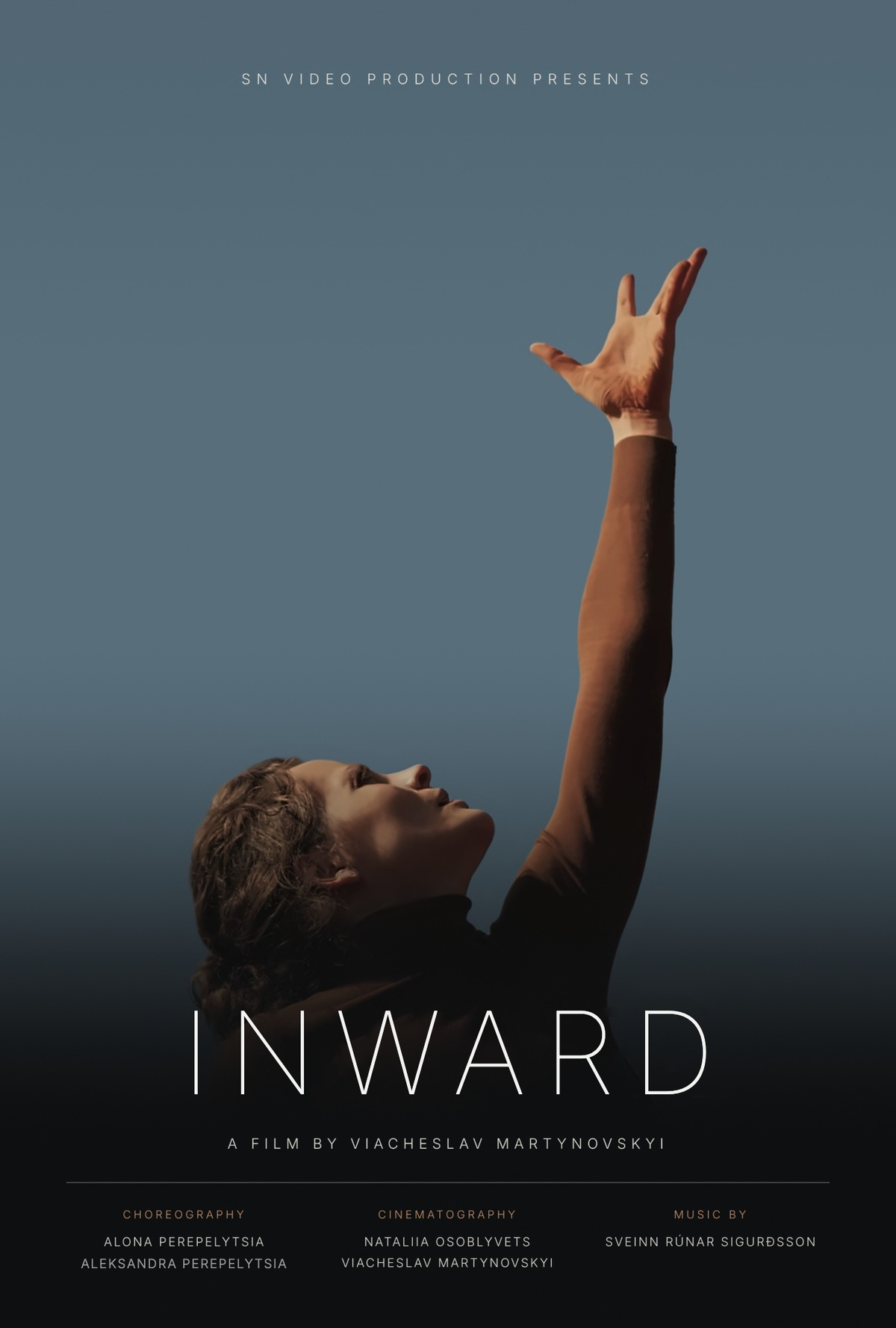 INWARD — official poster: a dancer reaches one arm up against a blue-grey sky.
